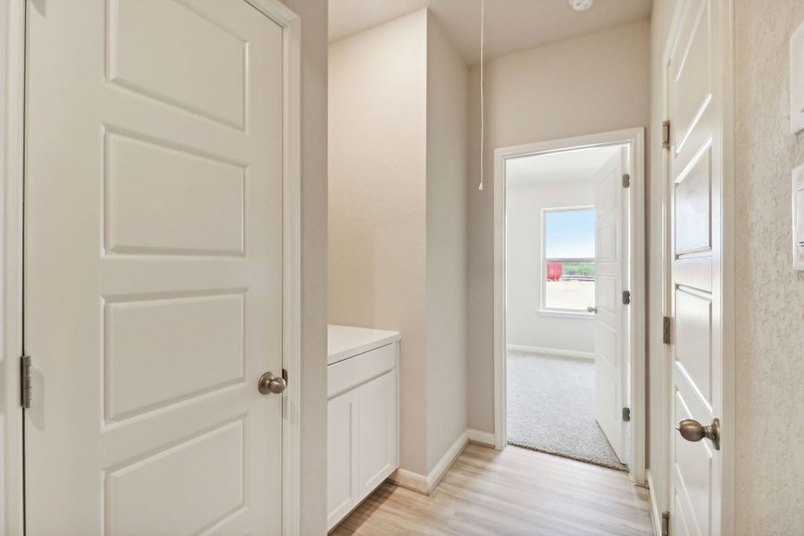 Hallway in the Callaghan floorplan at a Meritage Homes community.