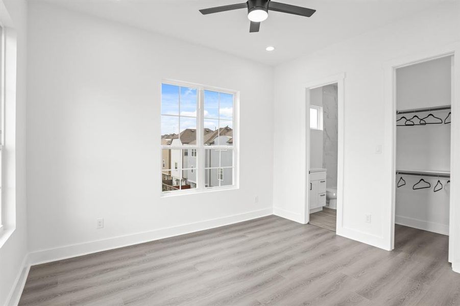 3rd floor bedroom with en-suite bathroom and walk-in closet.