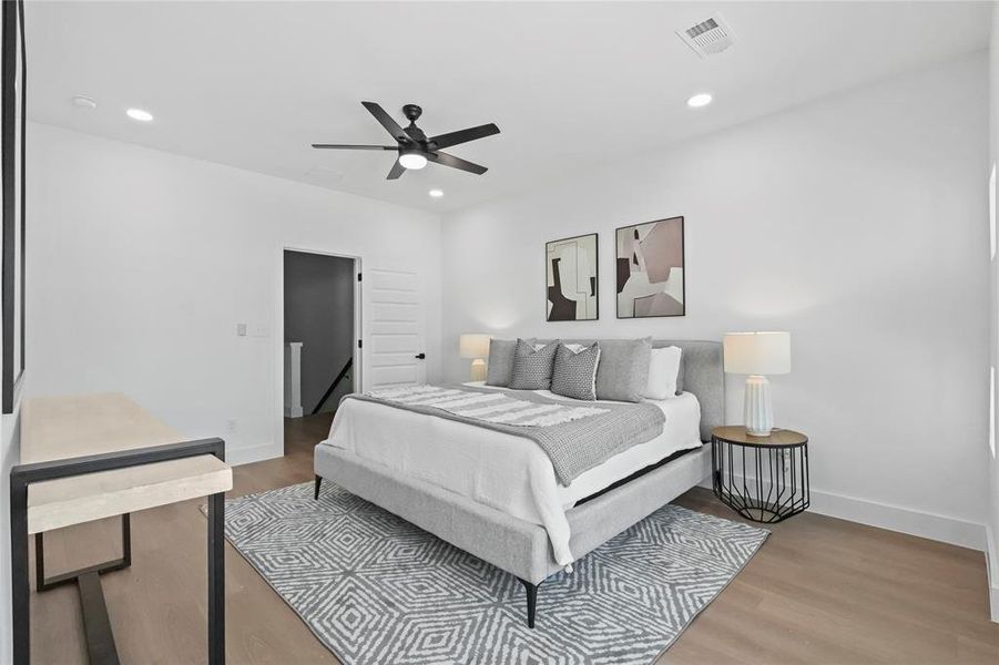 Bedroom featuring wood-type flooring and ceiling fan