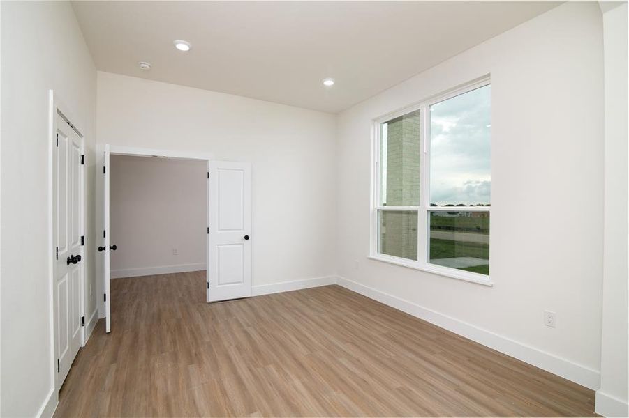 Spare room featuring light hardwood / wood-style flooring