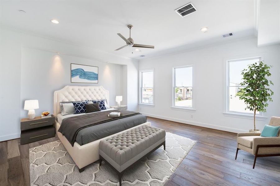 Soothing Primary bedroom with a bonus alcove and large windows.