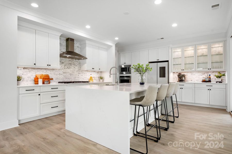 Beautiful Kitchen with Quartz Waterfall Island that seats 4.