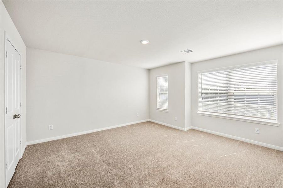 One of the three additional bedrooms in the home.