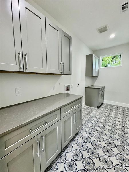 Spacious laundry room upstairs