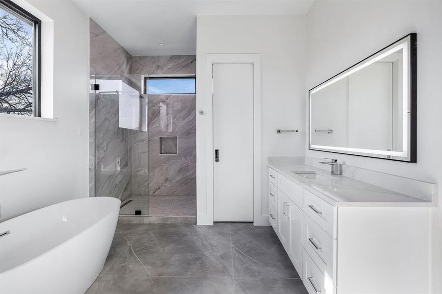 Bathroom with vanity and plus walk in shower