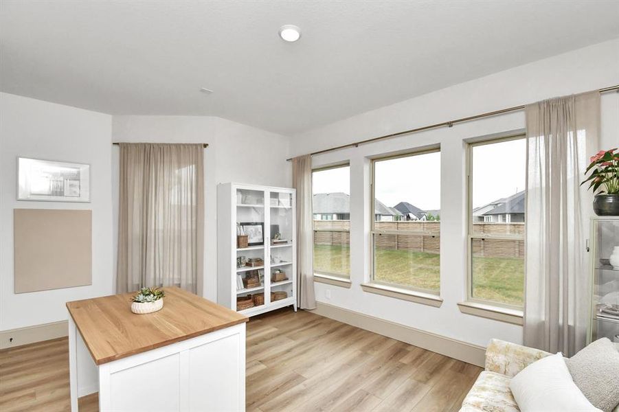 Sunroom/flex space just off the dining room.  This versatile space can be used as a craft room, formal living, or additional dining - the options are endless.