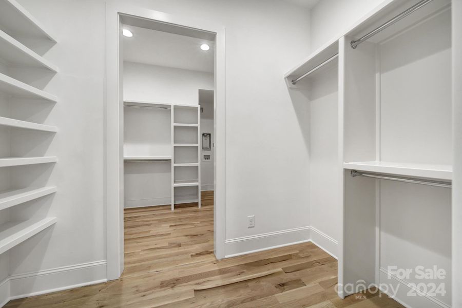 Extra large walk-in primary closet.