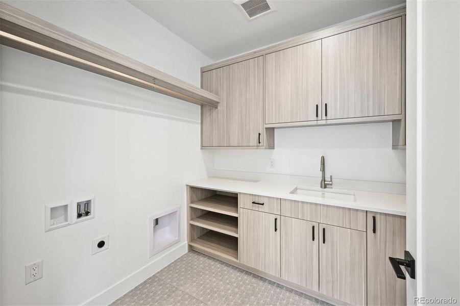 Big Laundry Room with Cabinets