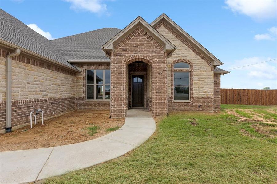 View of front of property with a front yard