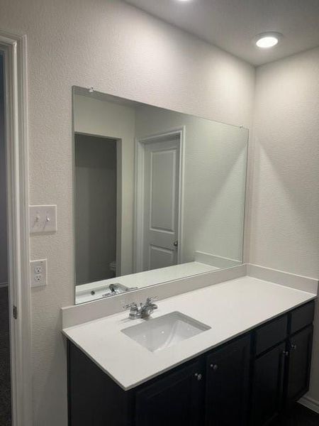 Bathroom with vanity and toilet