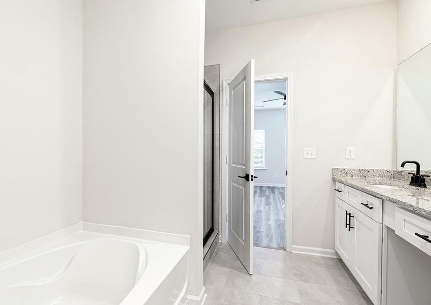 The master bathroom includes an incredible walk-in shower, bath tub and plenty of counter space to get ready in the mornings