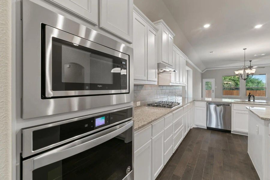 Kitchen | Concept 2533 at Abe's Landing in Granbury, TX by Landsea Homes