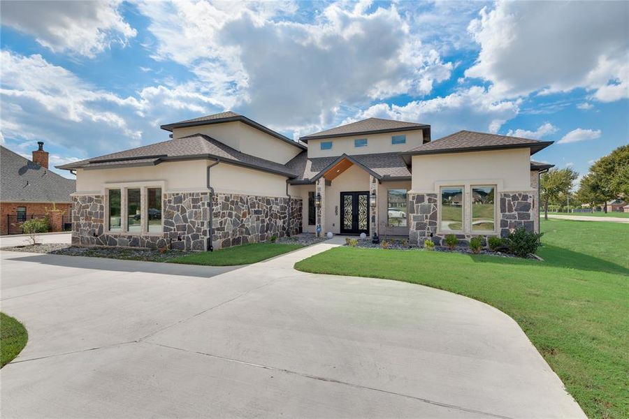 Prairie-style house featuring french doors and a front yard