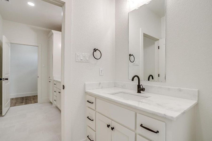 Bathroom with vanity and tile patterned flooring