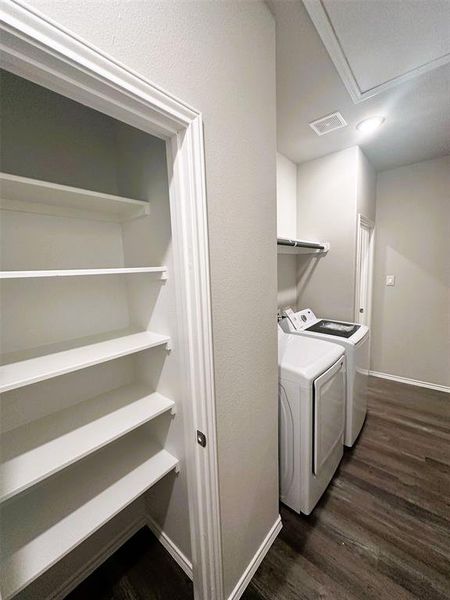 The utility room is complete with a storage closet!