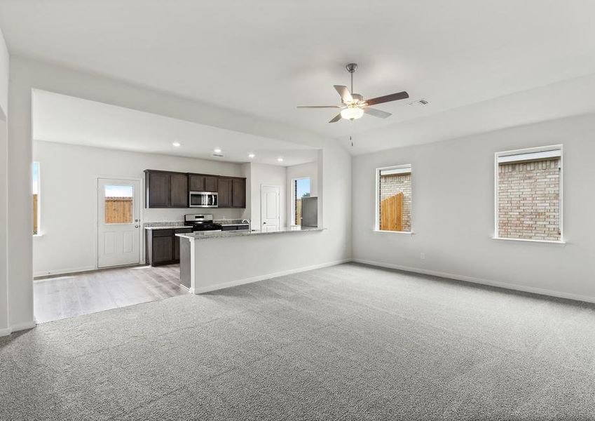 The open layout connects the family room with the kitchen and dining room.