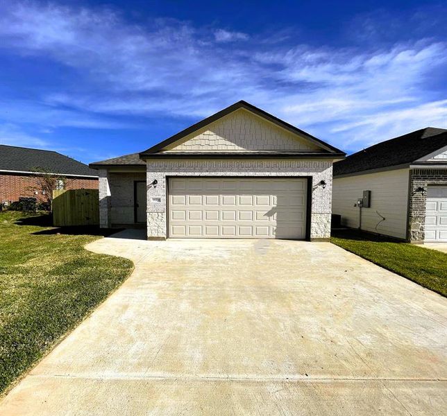 Gorgeous stone & brick front elevation on an oversized corner lot!