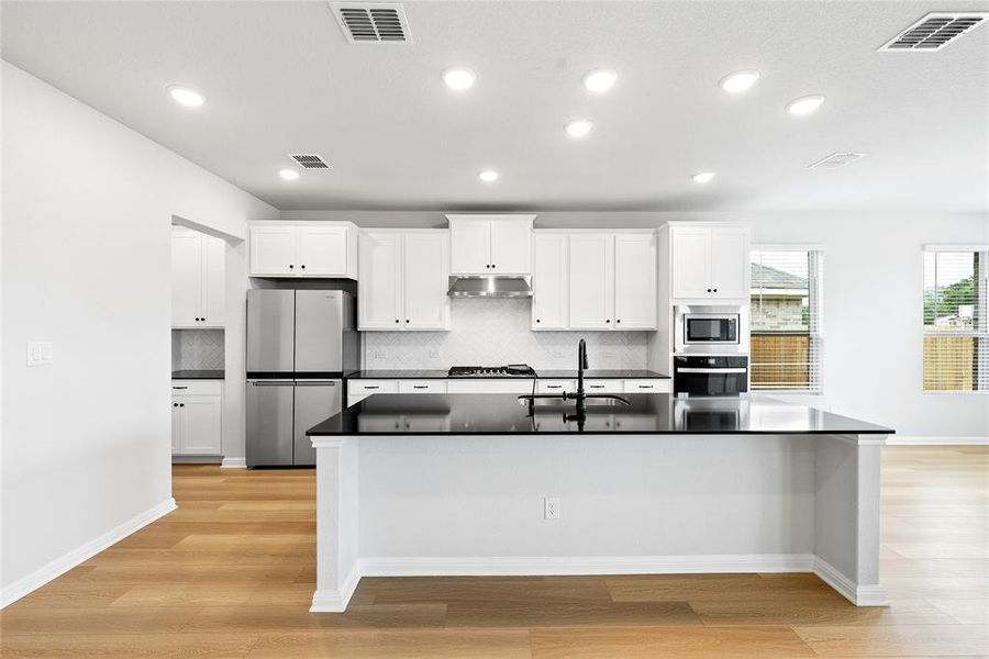 Kitchen with large island with seating