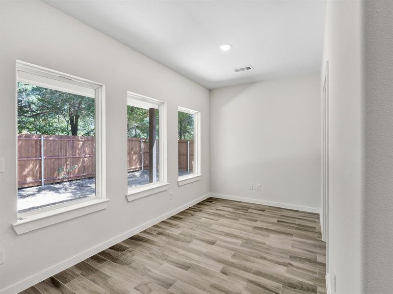 Spare room featuring light hardwood / wood-style flooring