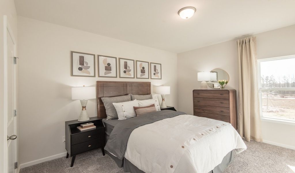 A full bedroom and bathroom on the main floor are perfect for guests.