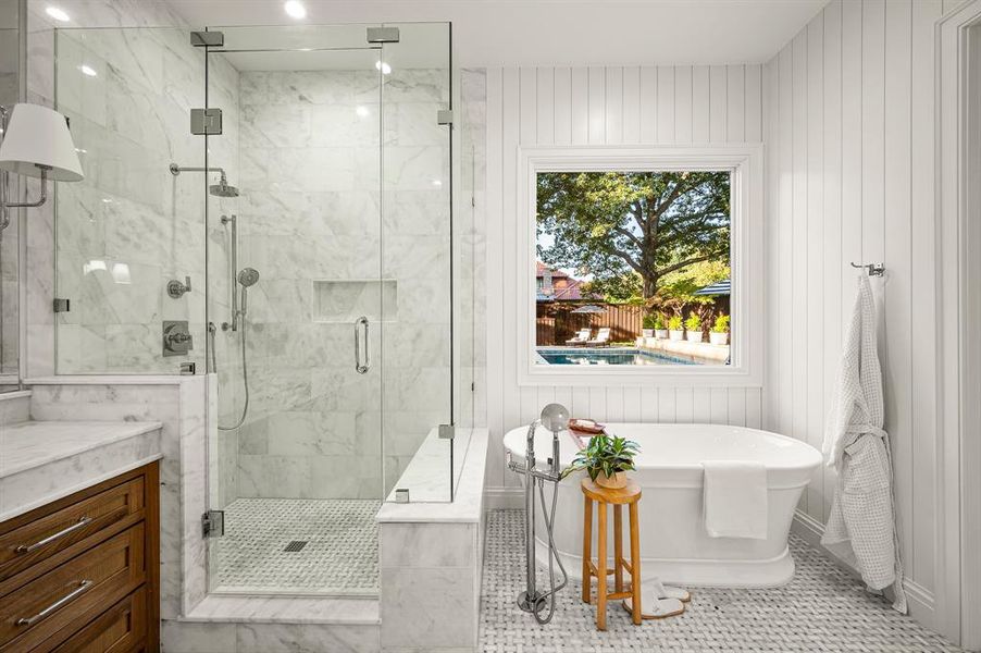 Bathroom with plus walk in shower, tile patterned flooring, wood walls, and vanity