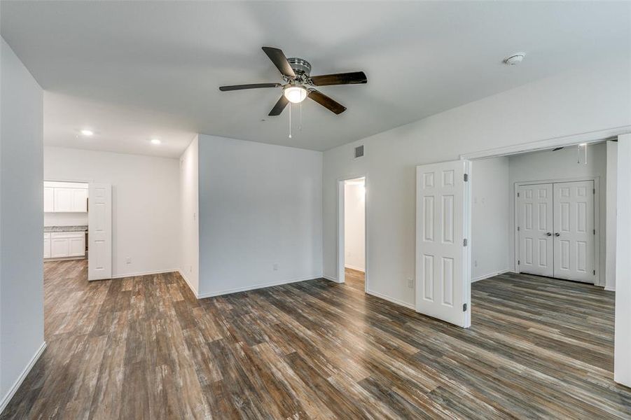 Spare room with ceiling fan and dark hardwood / wood-style floors