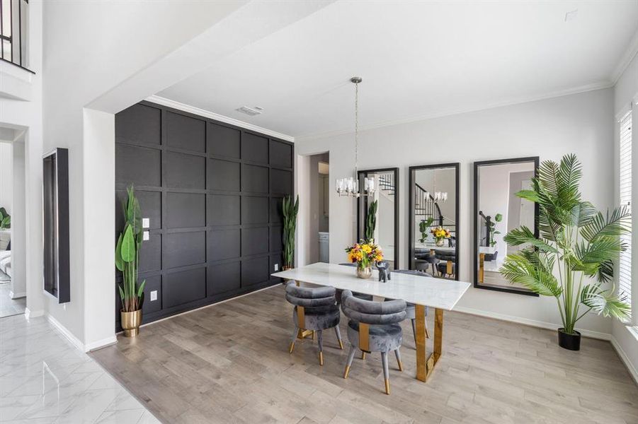 This dining room is bathed in natural light, offers a spacious open concept room for a comfortable family dinner or hosting. Creative designers can have fun furnishing this space to compliment the upgraded textured accent wall.