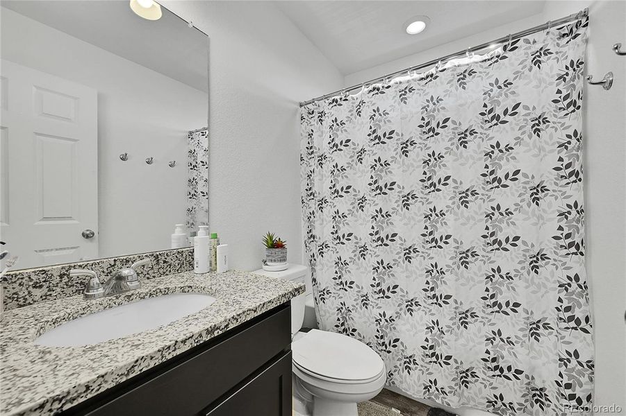 A bathroom is conveniently located on the upper level, near all of the bedrooms. Enjoy the laminate flooring, single vanity and spacious shower/tub combo.