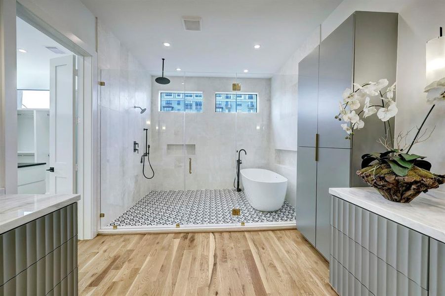 marble primary bath offering glass enclosed wet room plus dual counters