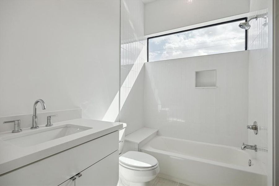 Another well lit secondary bathroom.