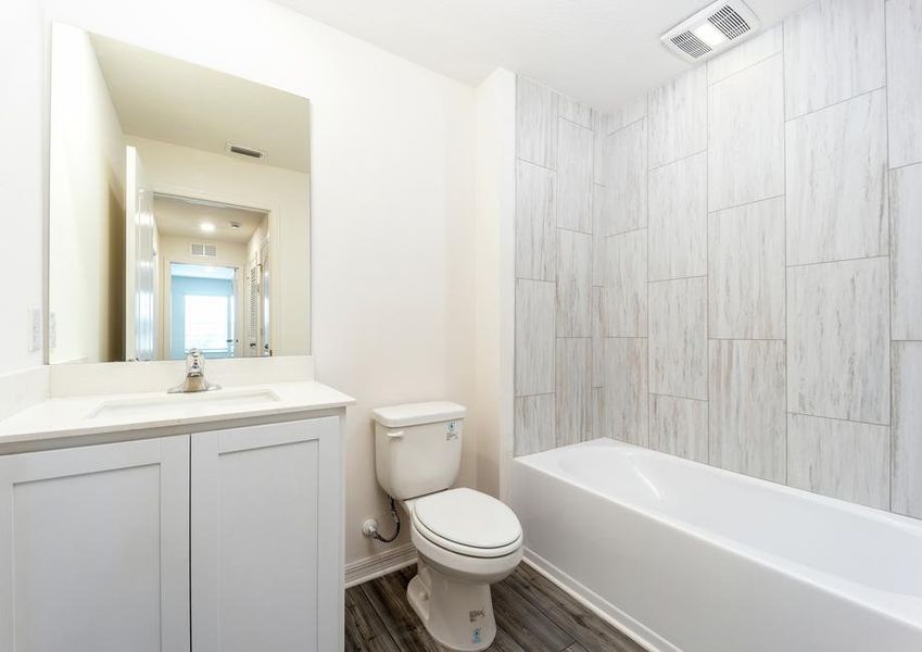 The secondary bathroom with tile detail