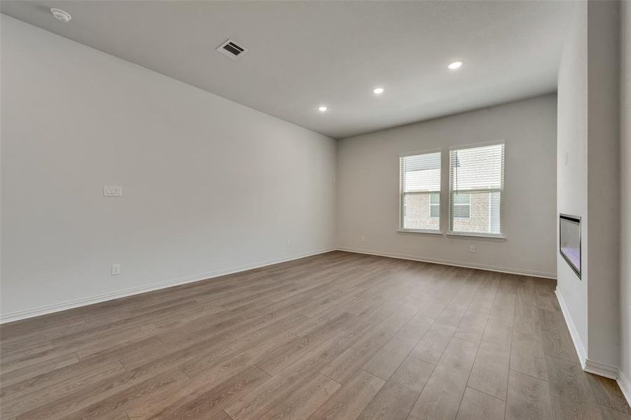 Spare room with light hardwood / wood-style floors