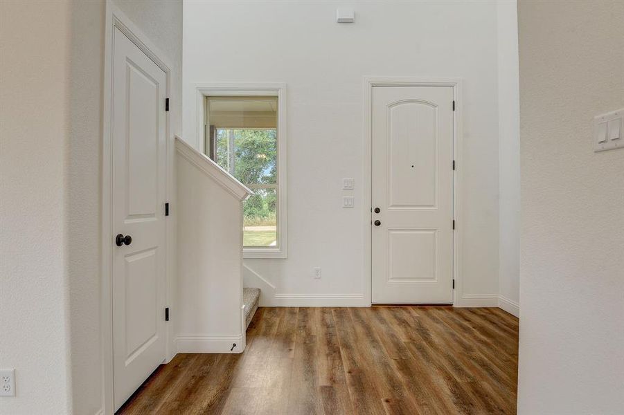 Entryway featuring wood-type flooring