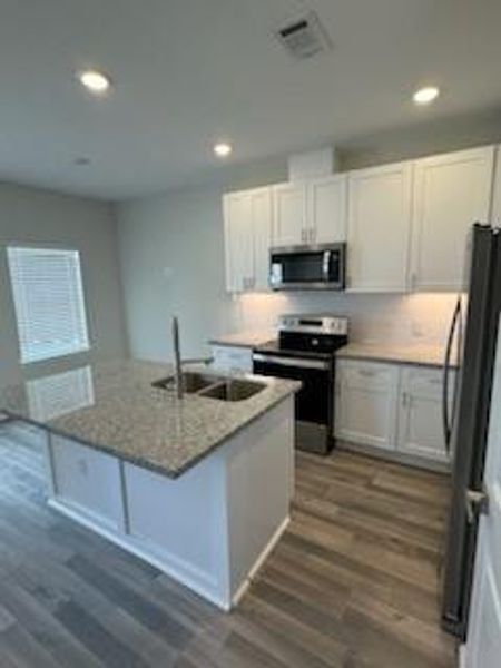 Kitchen has stainless steel appliances, all included. Under cabinet lighting.
