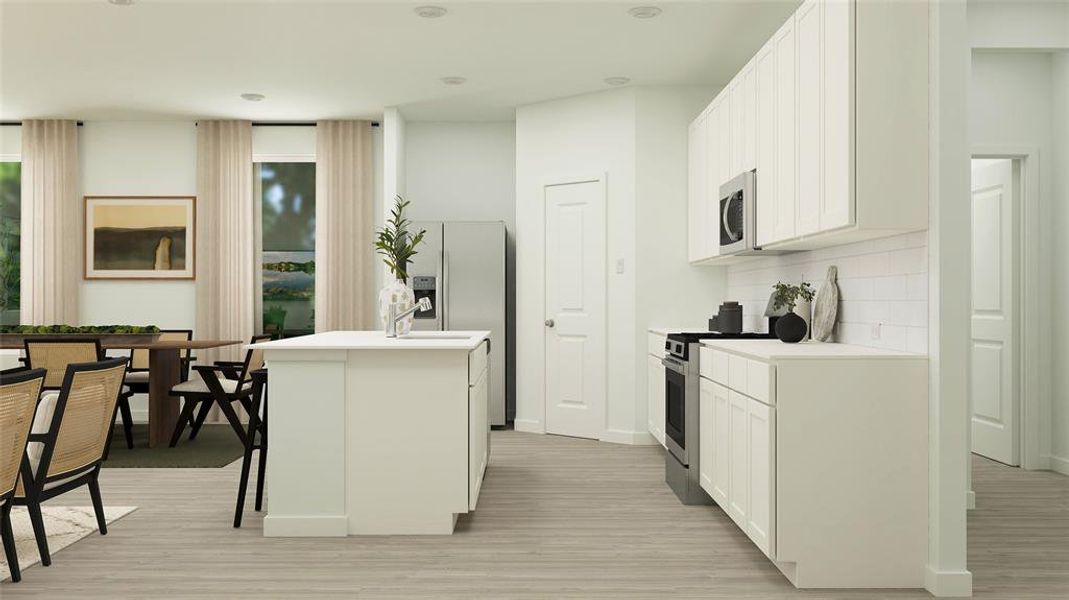 Kitchen featuring decorative backsplash, a kitchen breakfast bar, an island with sink, stainless steel appliances, and white cabinets