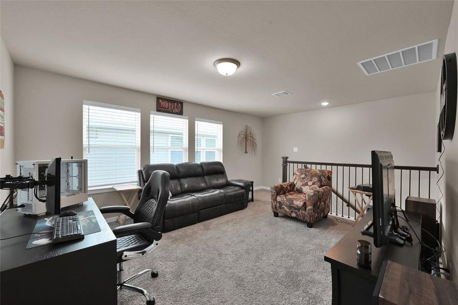 Just up the stairs, you'll find your spacious game room/flex space that is perfect for entertainment or relaxation.