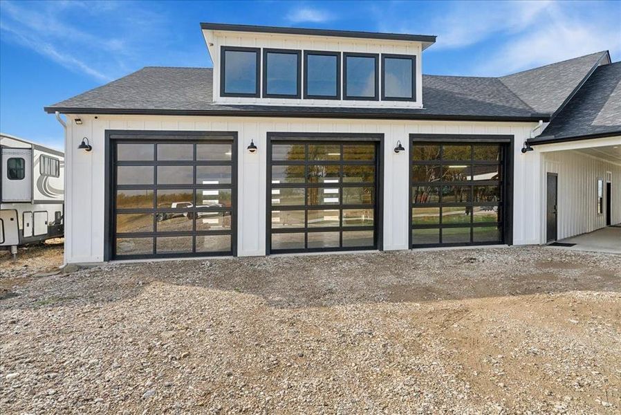 Back of property featuring a garage