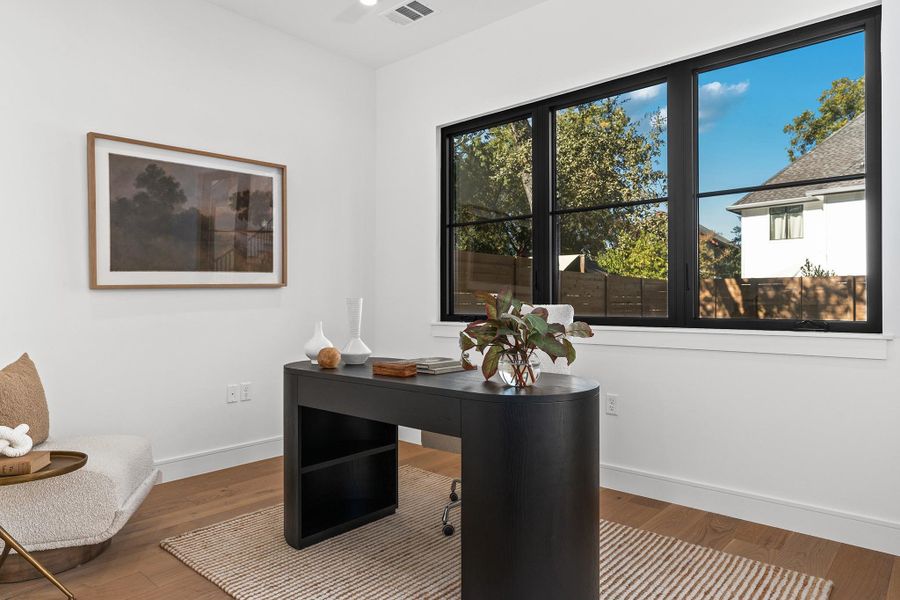 The dedicated downstairs office sits downstairs overlooking the pool. With three other spaces that could also be an office, this space could also be a guest bedroom, with private access to the first floor guest bath through its own pocket door.