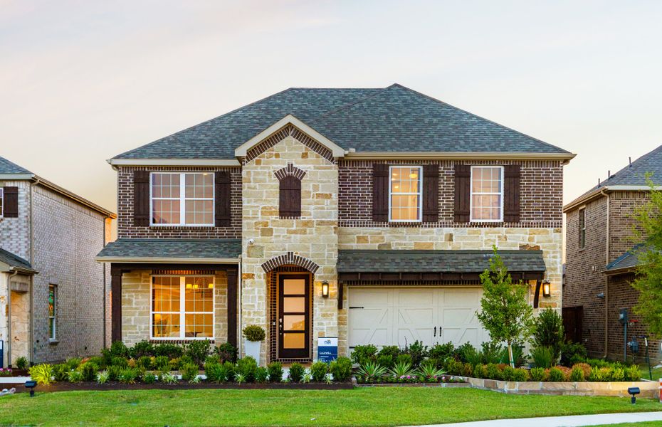 The Caldwell, a two-story home with covered front porch and 2-car garage, shown as Home Exterior D