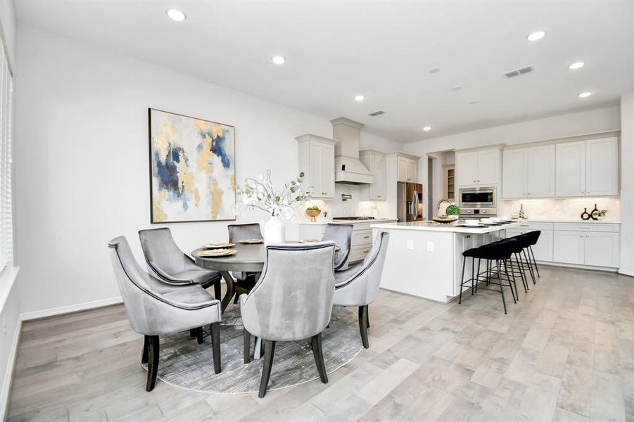 This thoughtfully designed homeseamlessly connects the kitchen witha charming breakfast area.