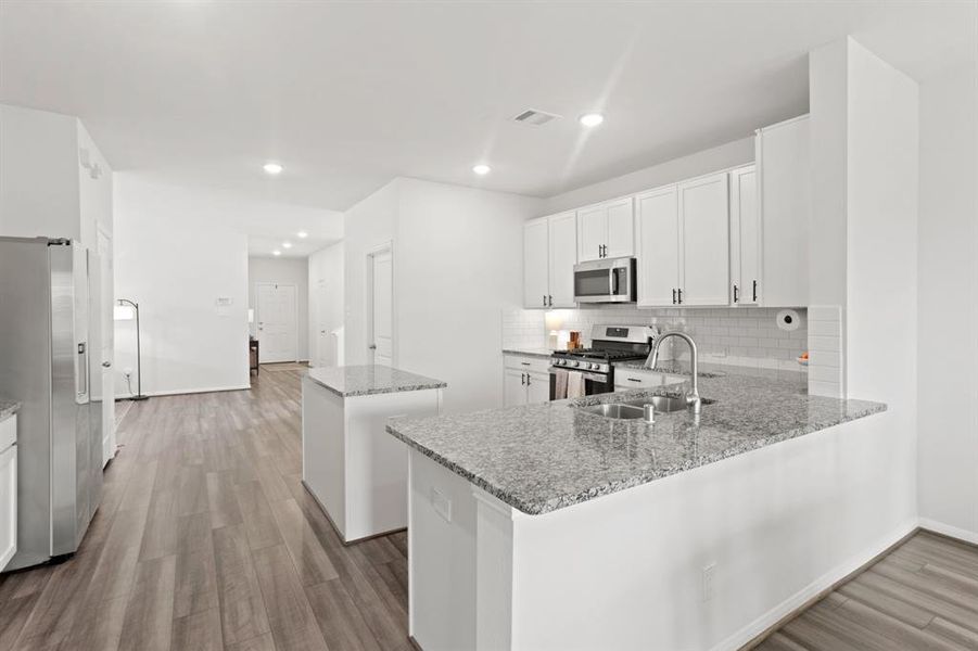 Experience the elegance of premium granite countertops paired with sleek, soft-close cabinetry in this modern kitchen designed for both style and functionality.