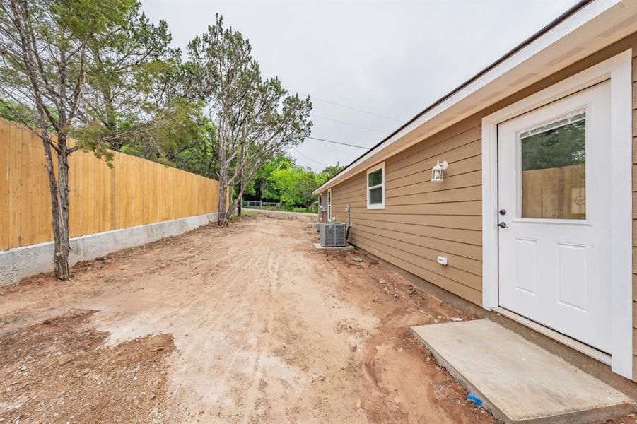 View of yard featuring a patio and central air condition unit