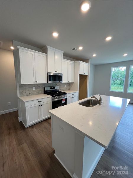 Chef-Inspired Kitchen with Quartz countertops and plenty of storage.