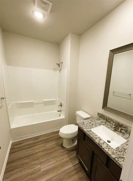 Bath 2 has linen shelves, granite counters & stylish framed mirror!