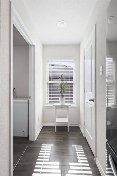 Corridor featuring dark hardwood / wood-style flooring