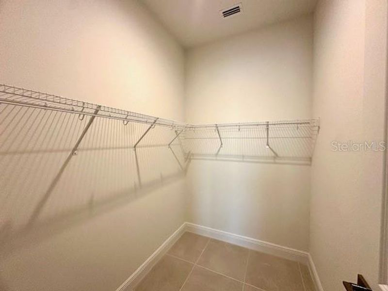 Walk-in closet in primary bedroom