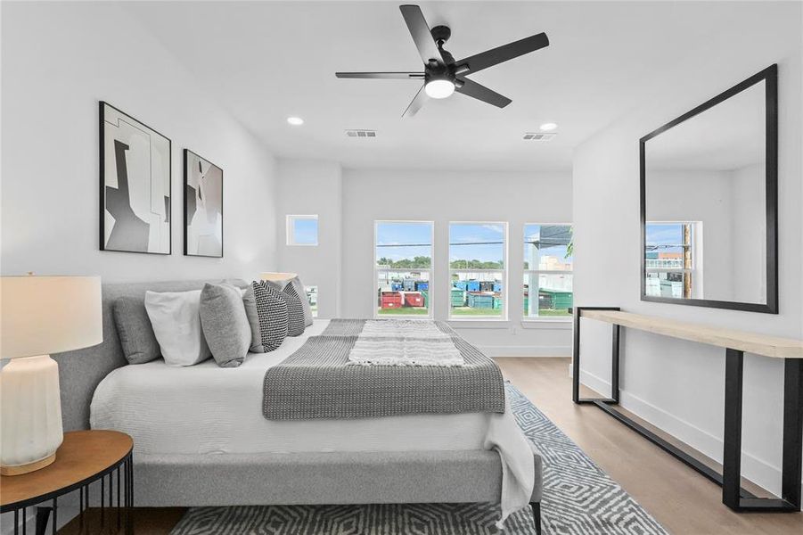 Bedroom with light wood-type flooring and ceiling fan