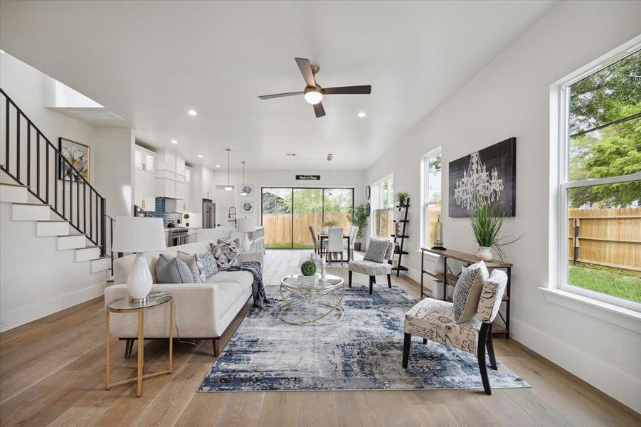 Inviting living room features abundant natural light, accentuated by spacious layout and neutral tones.