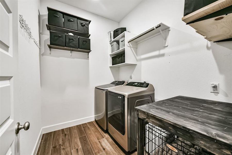 The laundry room features washer and dryer connections, andplenty of storage space.