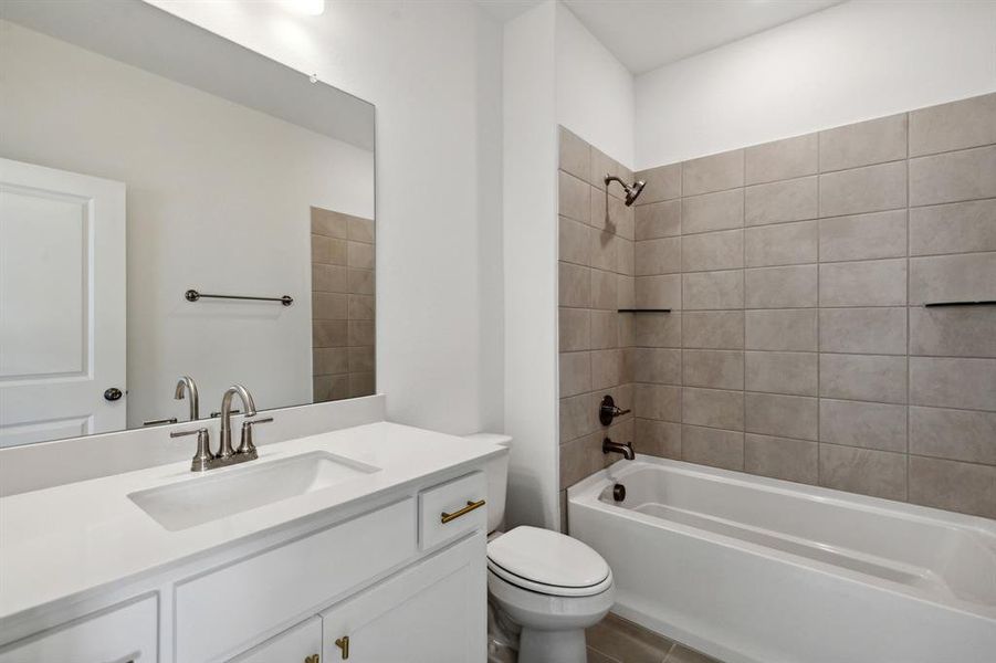 Guests will feel right at home in this beautifully finished guest bath.